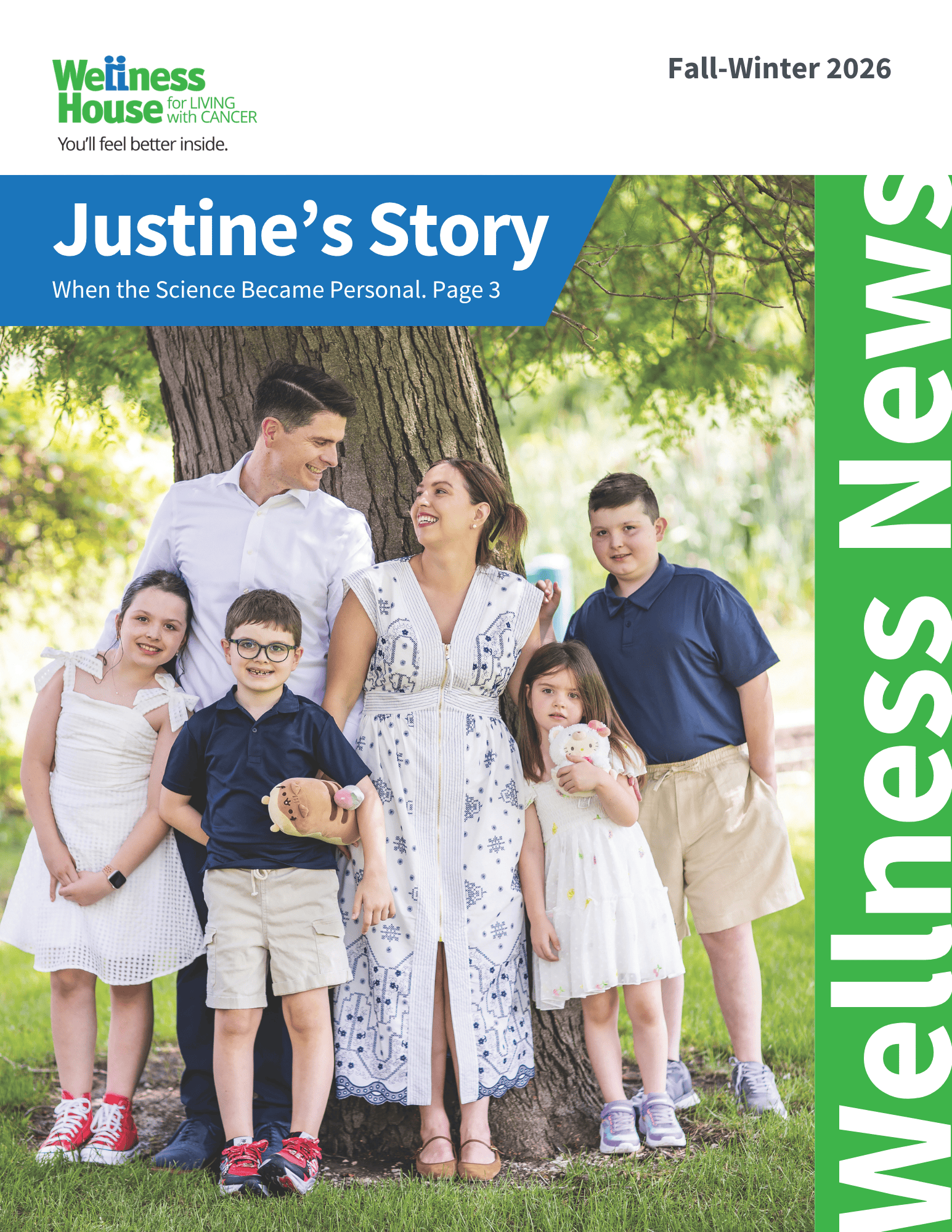 A family of six poses outdoors, all smiling. The woman in the center wears a white dress. Two adults and four children stand close together in front of trees, featured on a Wellness News magazine cover.